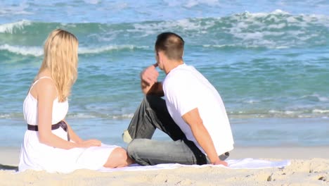 couple sitting on the beach