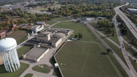 Flint,-Michigan-water-treatment-plant-and-water-tower-along-Dort-highway-and-475-with-drone-video-moving-at-an-angle-sideways