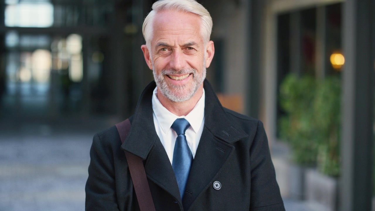 Portrait of a Mature Businessman Smiling Outdoors