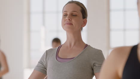 yoga class portrait young pregnant caucasian woman practicing poses holding belly enjoying group exercise in fitness studio