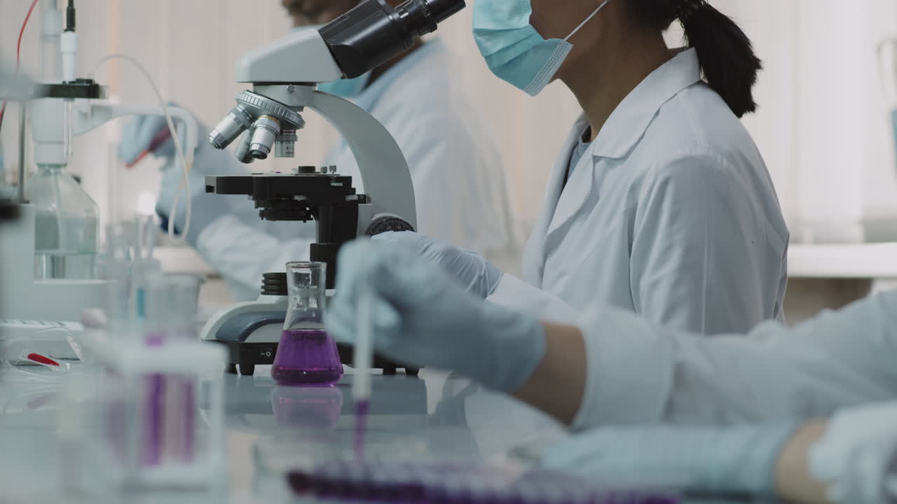 Asian Female Scientist Turning Towards Camera