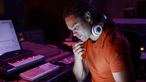 male sound engineer working at a mixing desk