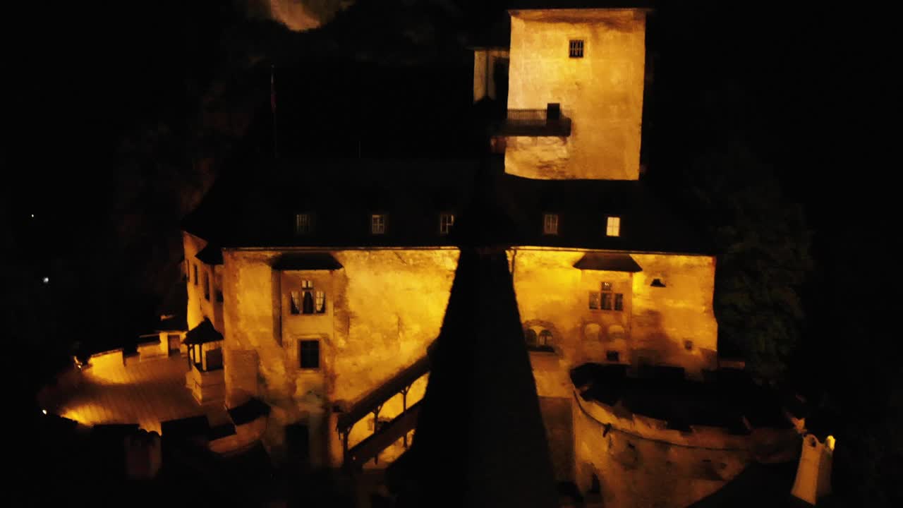 Aerial tele shot close to Orava Castle by night - Yellow lights