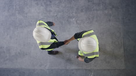 construction workers handshake