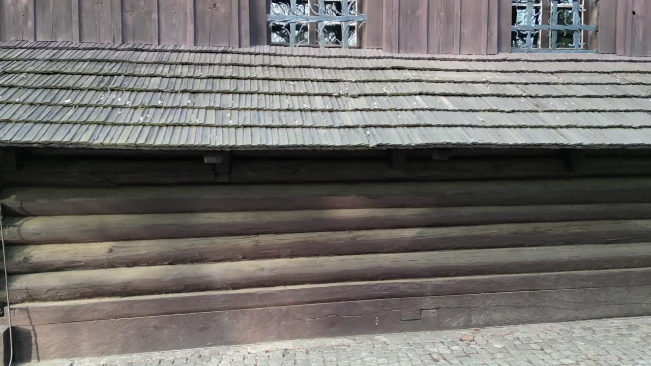 Old Wooden Church Exterior with Log Walls and Shingle Roof