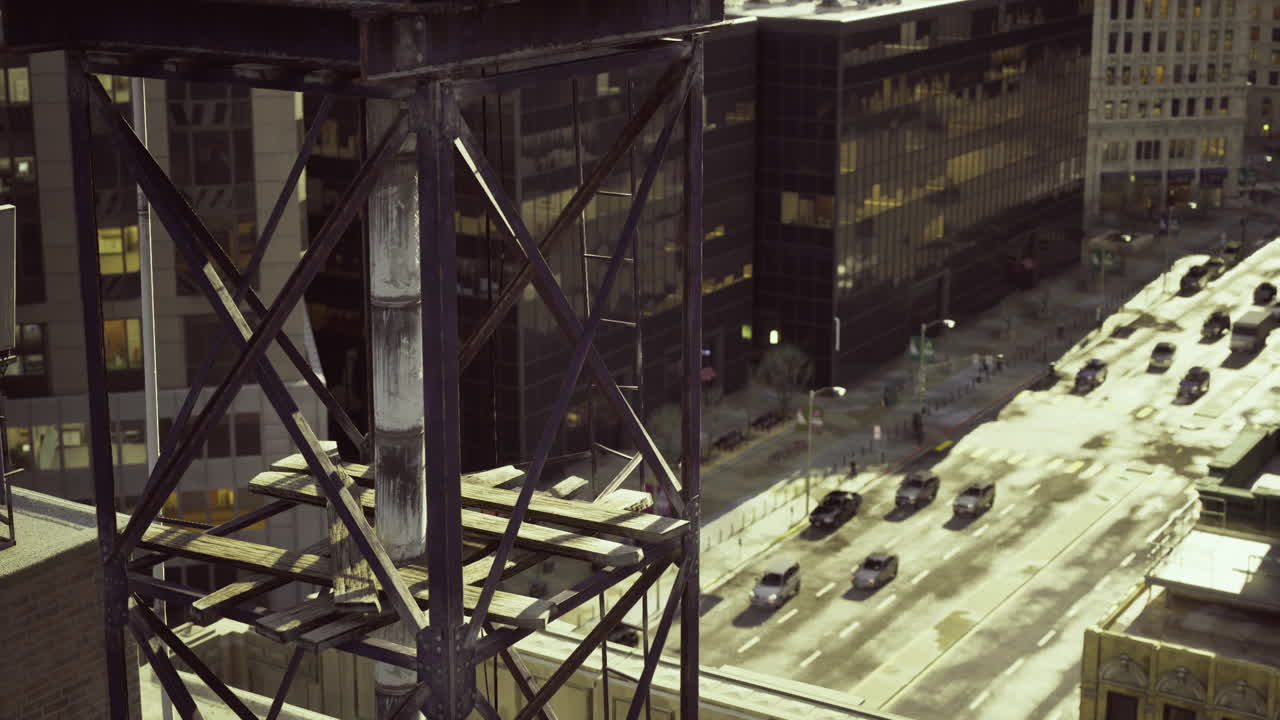 City skyline view from rooftop during evening with illuminated buildings