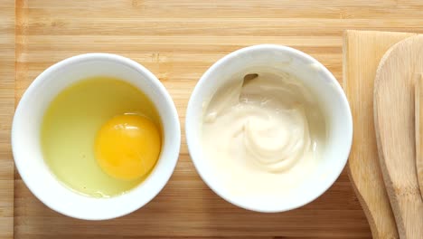 Top-view-of-milk-cream-in-a-container-on-table