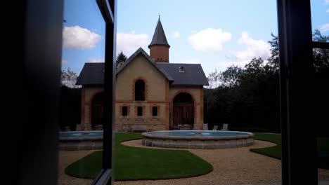 revealing through the window, the view unfolds onto a scene of timeless beauty, showcasing the rich tapestry of france's traditionally built architectural heritage