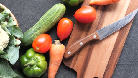 assortment of fresh vegetables on a cutting board