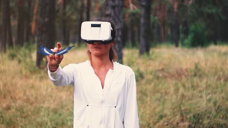 Woman Experiencing Virtual Reality in a Forest