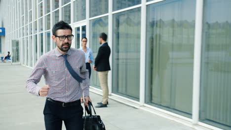 busy businessman running to work