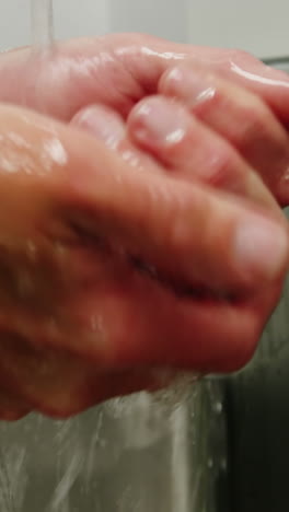 close-up of surgeons washing his hands