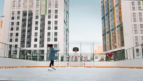 woman ice skating in an urban winter setting