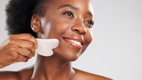 facial, massage and stone with a model black woman