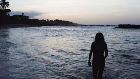 Silhouette-of-Woman-Walking-on-Tropical-Beach-in-Dominican-Republic