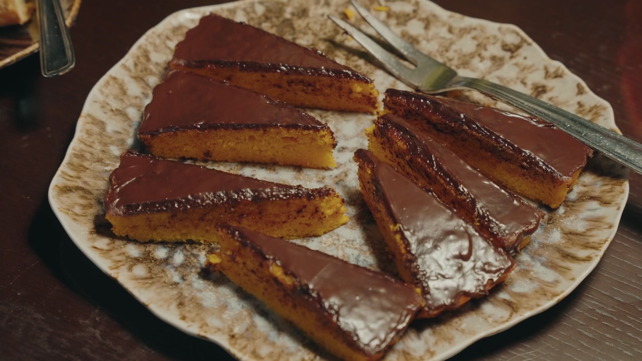 triangular cake pieces with chocolate topping served on dish