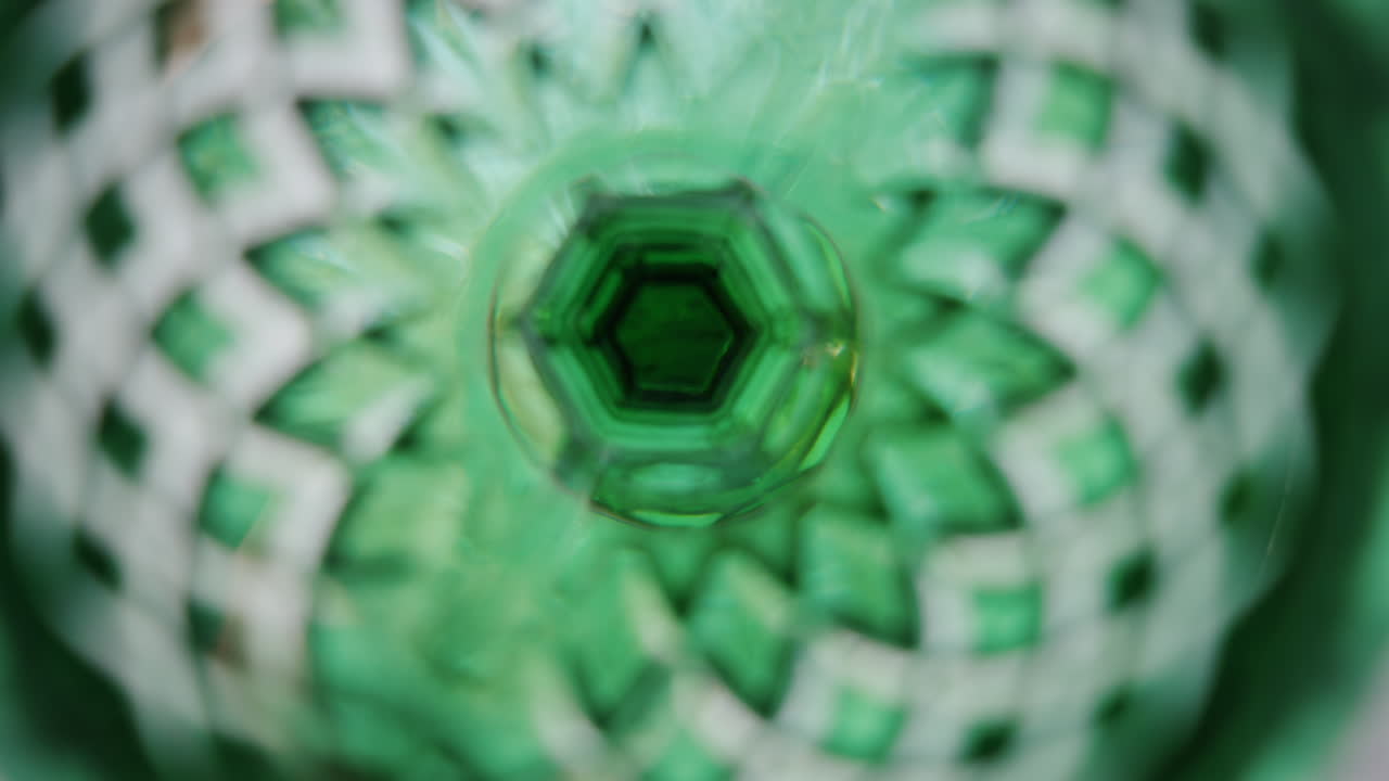 Close up of the inside of a green glass with triangle decorations