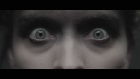 a woman dressed as mother opens her eyes