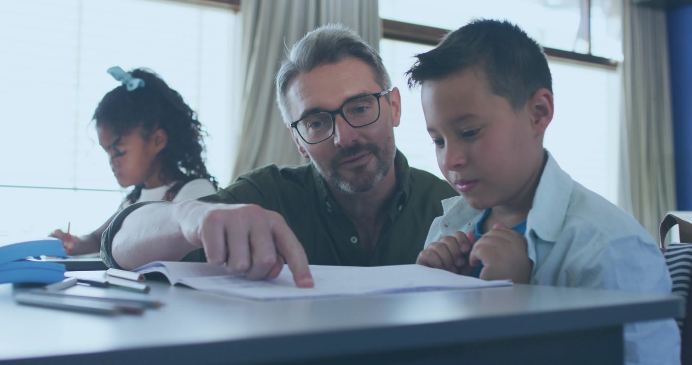 Teacher guiding boy pointing workbook sparking animated data icons and code overlays for education