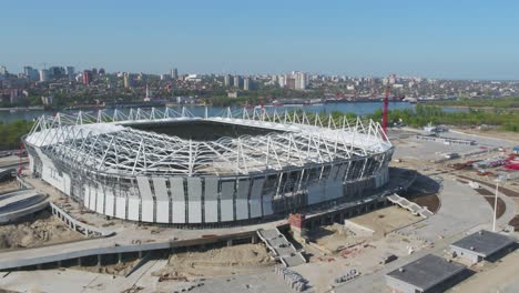 aerial view of a new stadium under construction near a river