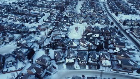 Flying-a-drone-over-a-winter-community-in-Calgary-during-a-stunning-sunrise