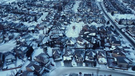 flying a drone over a winter community in calgary during a stunning sunrise