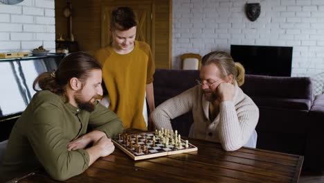 caucasian men and boy in the living room