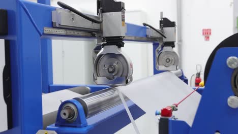 worker preparing plastic grains for eva film at extrusion machine