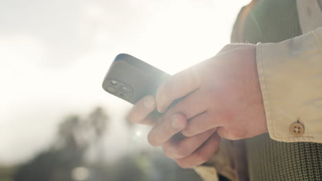 smartphone, hands and outdoor person typing