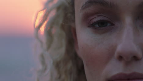 close-up-portrait-of-beautiful-woman-enjoying-peaceful-seaside-at-sunset-contemplating-journey-exploring-spirituality-feeling-freedom-with-wind-blowing-hair