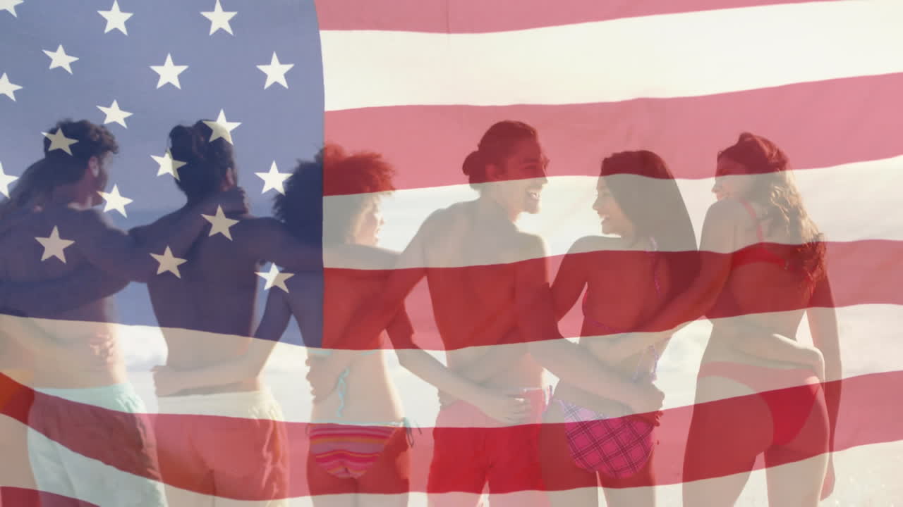 Animation of american flag waving over group of friends embracing on beach