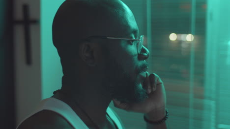 African-American-Man-Talking-on-Phone-at-Home-in-Night