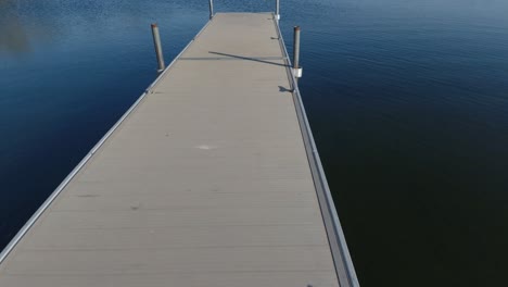 fast drone fly over dock into lake