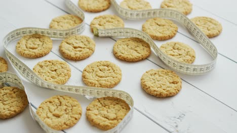 healthy oatmeal cookies on white wood background  side view