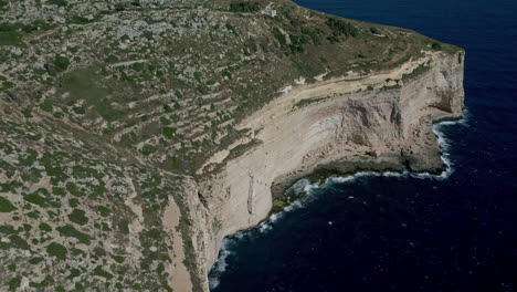 Aerial-Dingli-cliff,-Malta-over-deep-blue-Mediterranean-sea-at-midday