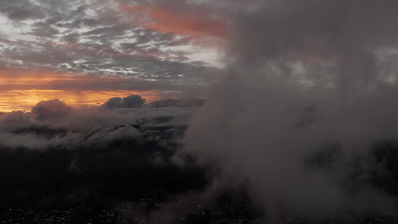 DRONE SHOT OF A SUNSET IN URUAPAN MICHOACAN OVER THE CLOUDS