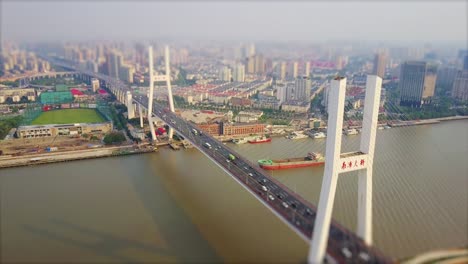 day time shanghai cityscape traffic lupu bridge riverside aerial panorama 4k tilt shift china