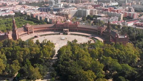 pull back drone shot of the famous plaza de espana in seville, spain