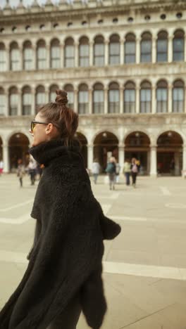 woman walking in st. mark's square, venice