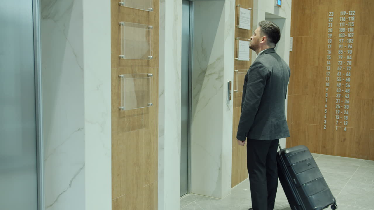 Businessman Waiting for Elevator