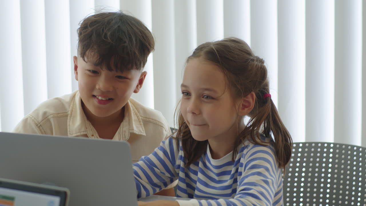 Cheerful Biracial Kids Coding on Laptop at Computer Class