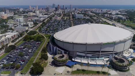 4K-Aerial-Drone-Video-of-Domed-Roof-of-Tropicana-Field-with-Waterfront-Skyline-of-Downtown-St