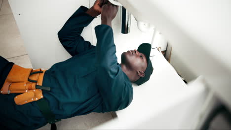 plumber repairing sink