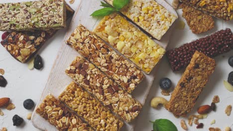 various kinds of protein granola bars with dry fruits and berries