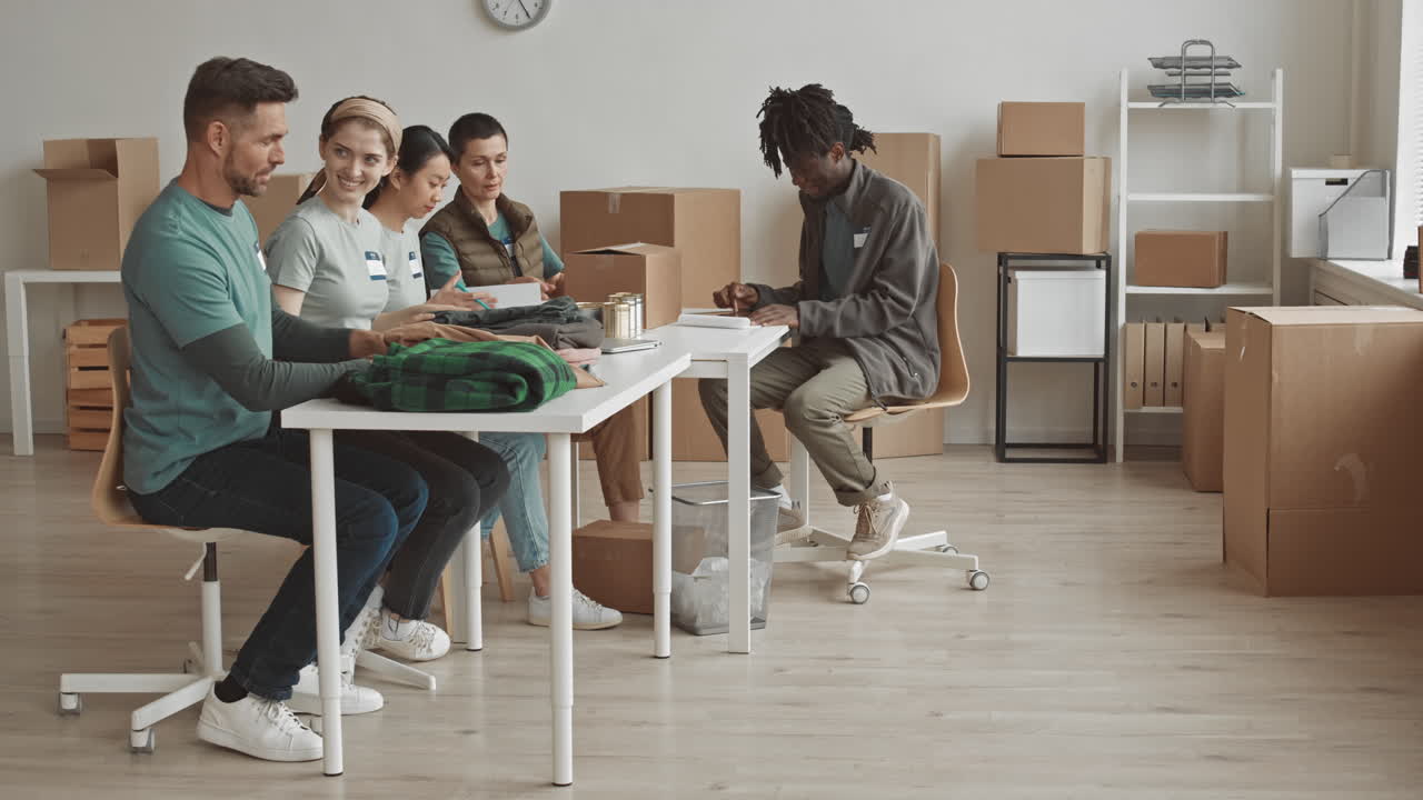 Volunteers packing donations in an office
