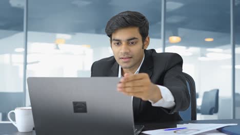 indian employee finishes the work and relaxes