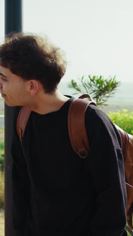 man waiting for someone to come near the sea and pick him up