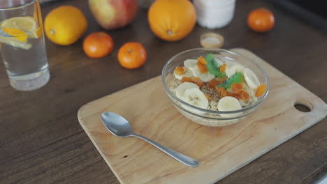 preparing breakfast with fruit and oatmeal