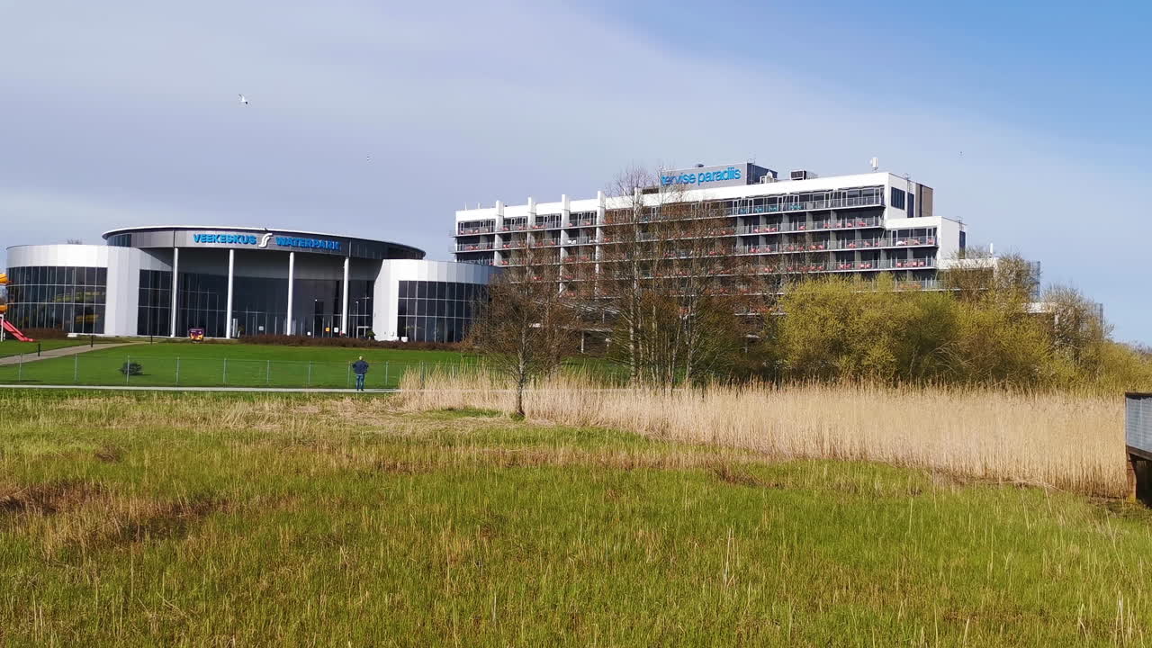 Modern leisure complex with lawn and walking path