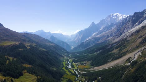 drone shot flying through a valley in the italian alps